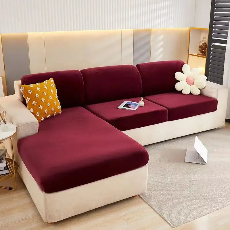 Burgundy velvet stretch sofa cover with soft plush texture and clean lines elegantly draping sectional frame