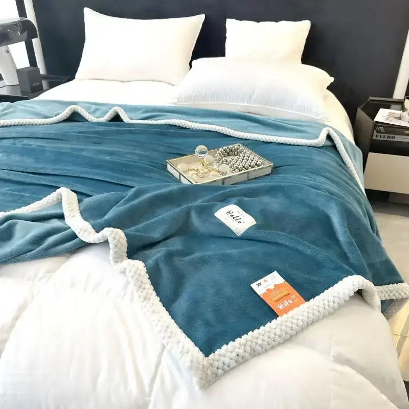 Teal cozy flannel nap blanket with white knitted border and soft plush velvety texture for bedroom use
