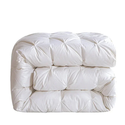 White goose down quilt with white quilted comforter featuring plush texture and diamond-shaped stitching for warmth
