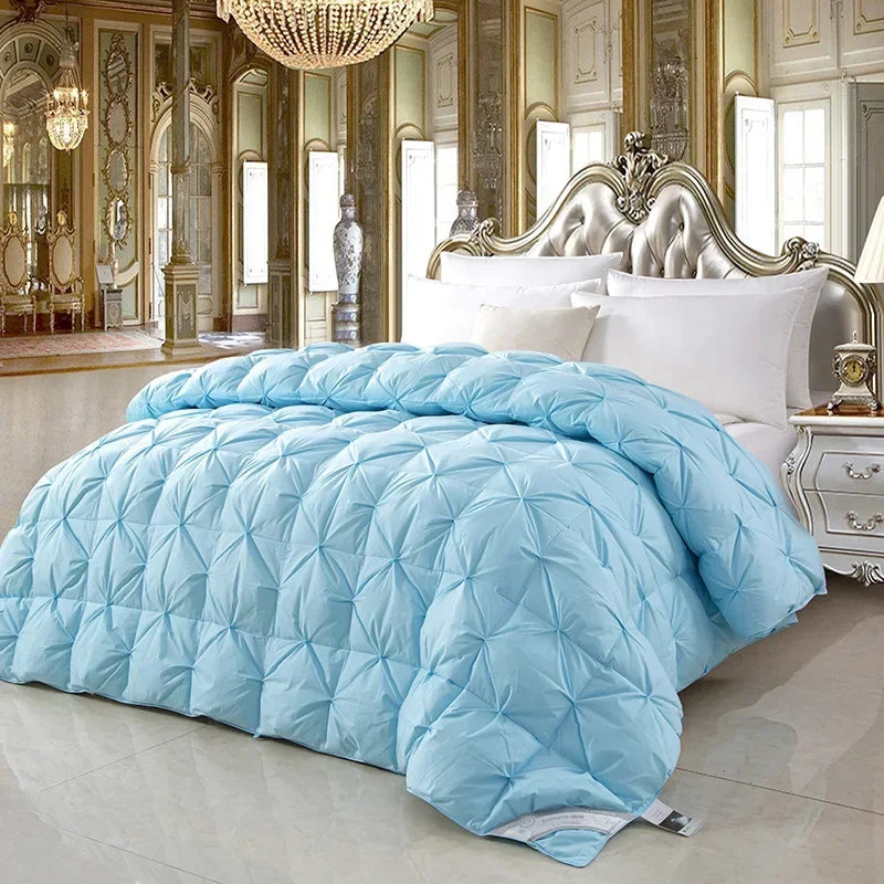 Light blue quilted comforter with diamond-stitched pattern featuring white goose down for warmth and comfort