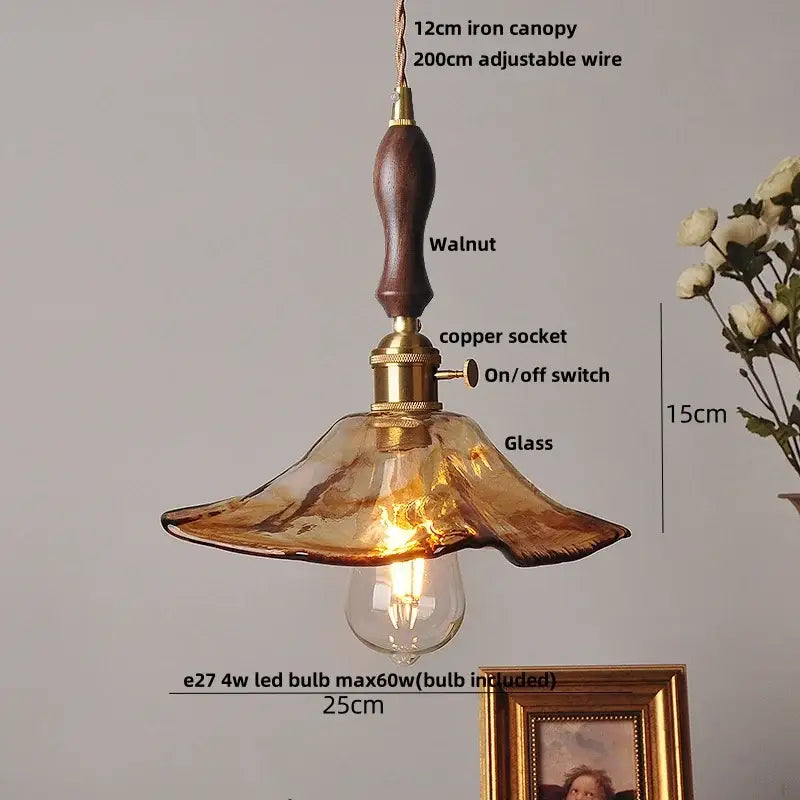 Warm amber glass pendant light with walnut iron canopy and brass accents for dining room decorbites amber glass pendant
