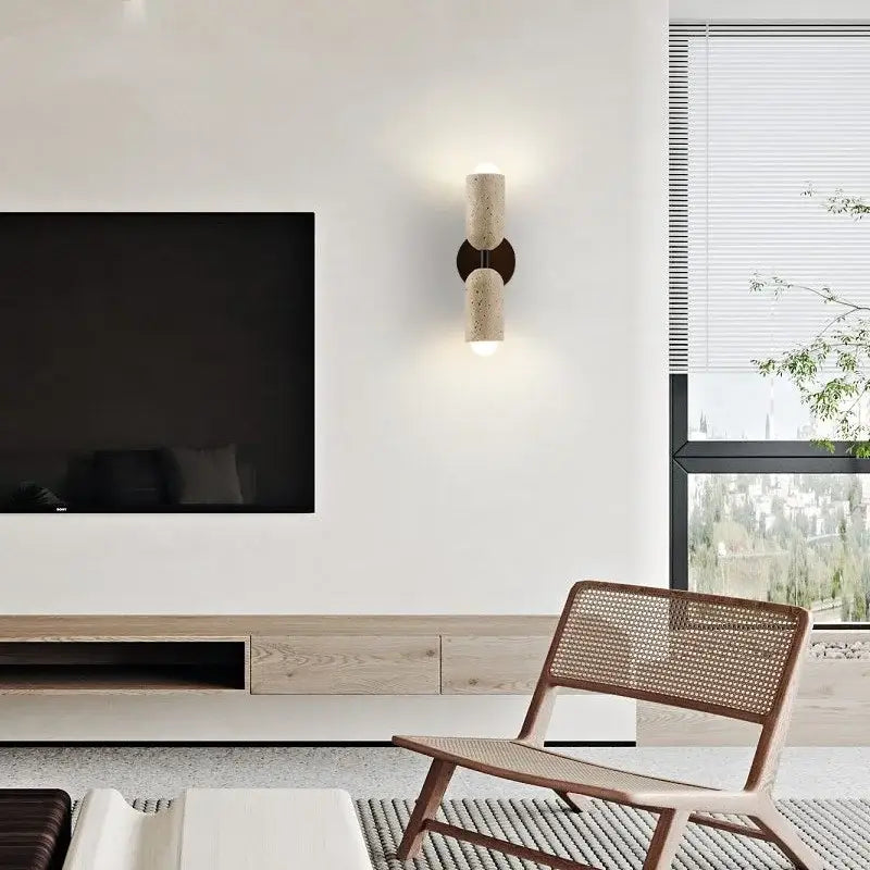 Modern cylindrical led wall light with textured beige concrete finish and dark bronze accents for bedroom decorbites led wall