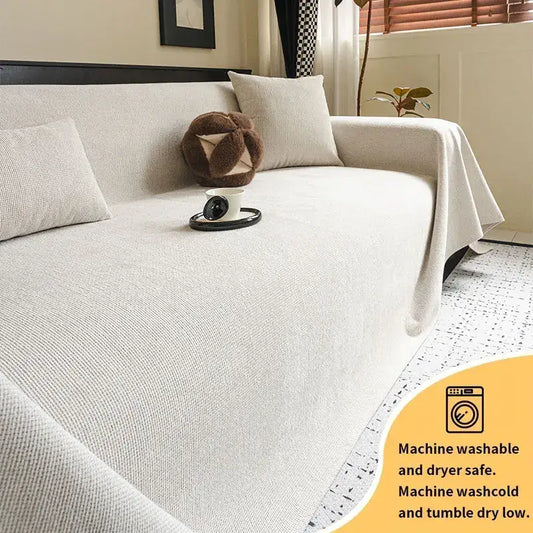 Beige textured sofa cover with subtle woven pattern and anti-slip backing designed for easy machine washing and drying