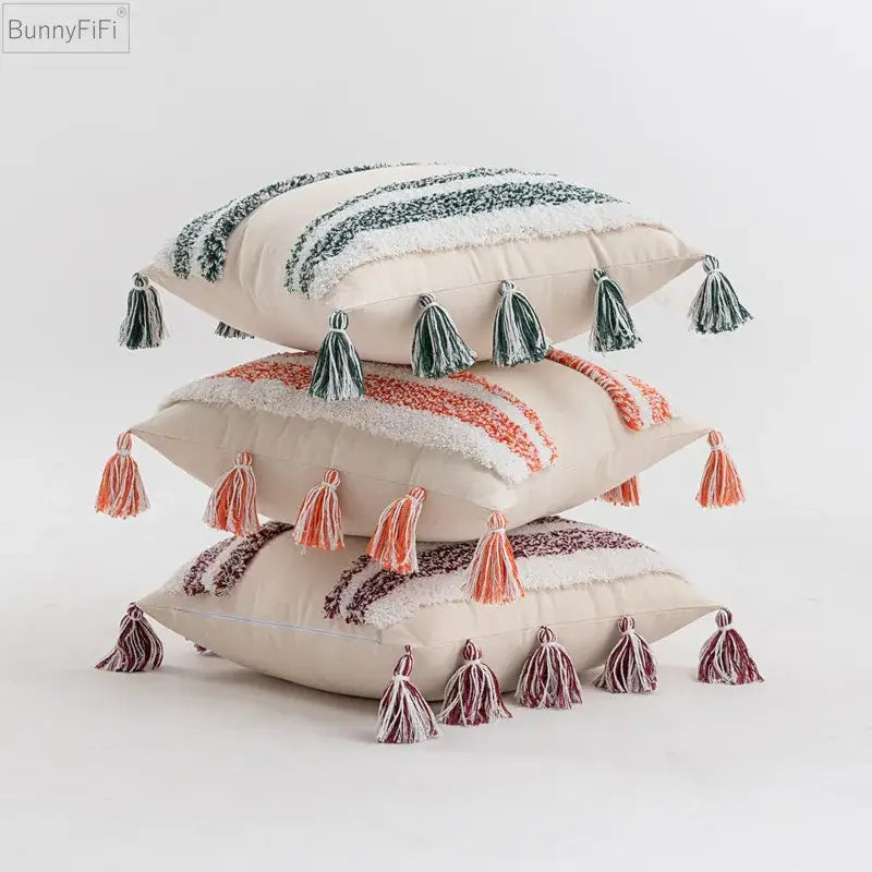 Stacked decorative throw pillows with textured blue and beige striped cushion cover and tassels for home decor decorbites blue grey