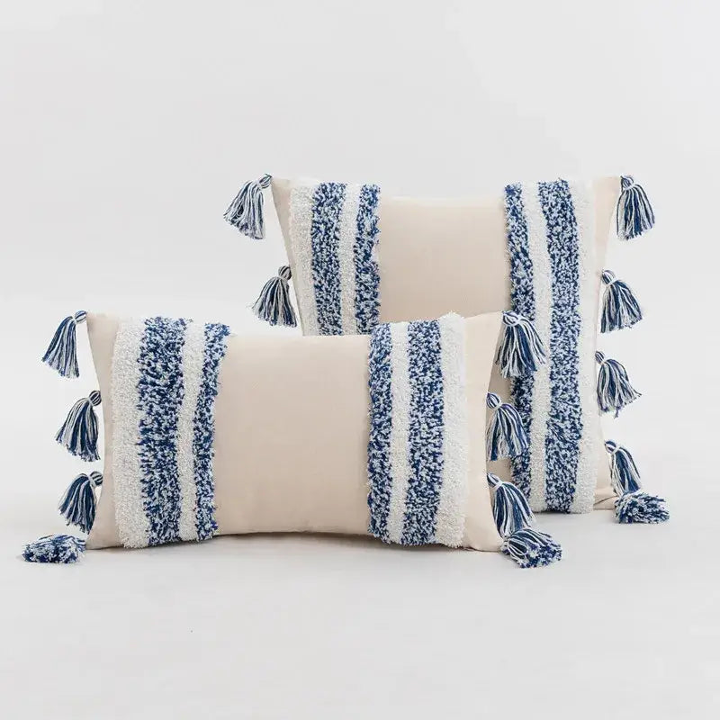 Cream-colored cushion cover with textured blue and white vertical stripes and tassels for home decor by decorbites blue grey