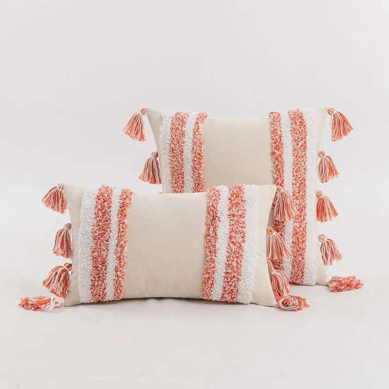 Cream-colored throw pillows with coral white textured yarn stripes and tassels for home decor cushion cover decorbites blue grey