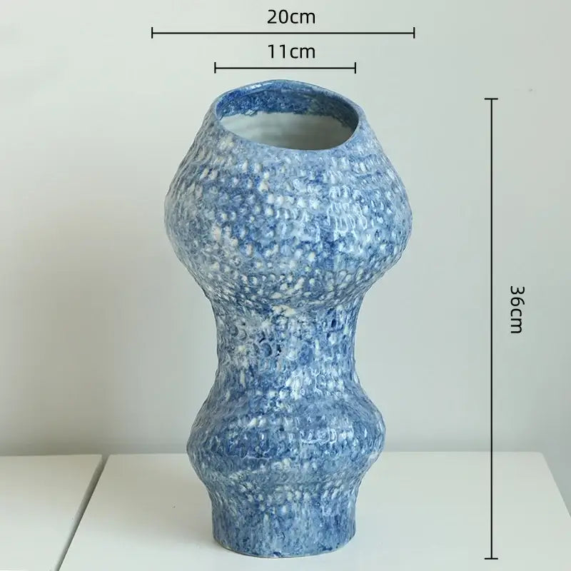 A tall textured blue ceramic vase with speckled glaze and organic shape for ceramic vase hydroponic decorbites blue ceramic