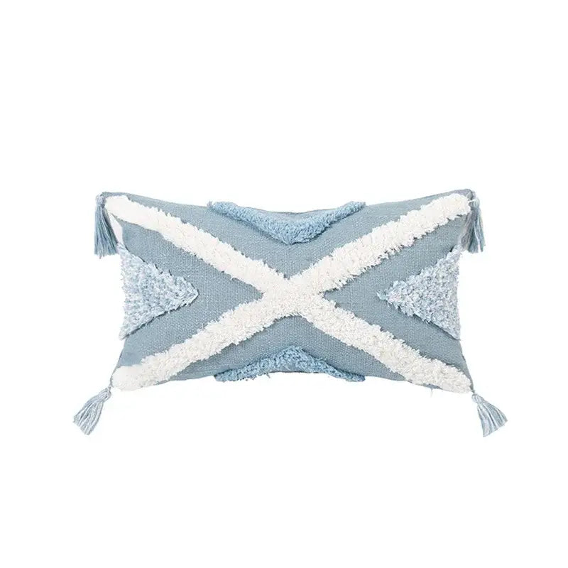 Light blue woven cushion cover with white cross accents and tassels perfect for decorbites blue geometric living room decor