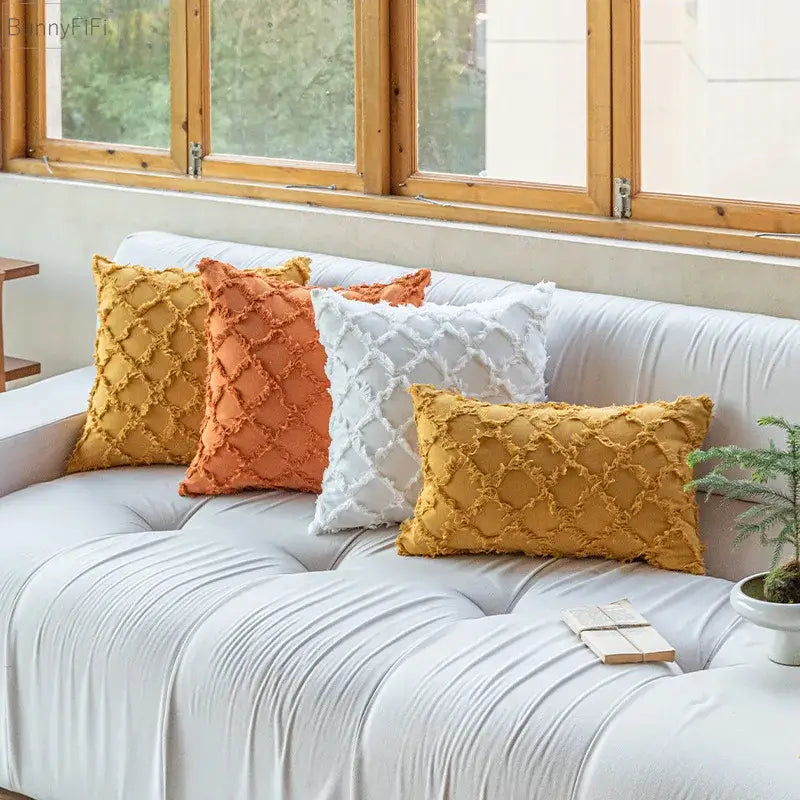 Set of four decorbites cotton diamond cushion covers in mustard yellow, terracotta orange, and white for living room decor