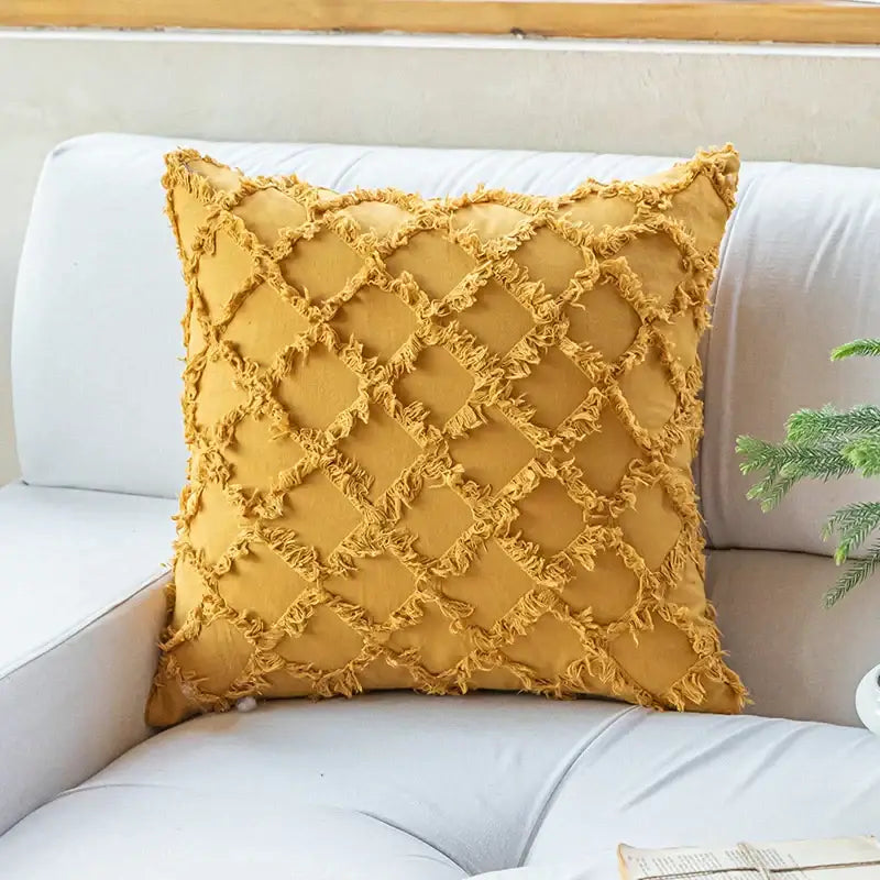 A mustard-yellow cotton diamond cushion cover with textured pattern and frayed edges for living room decorbites decor