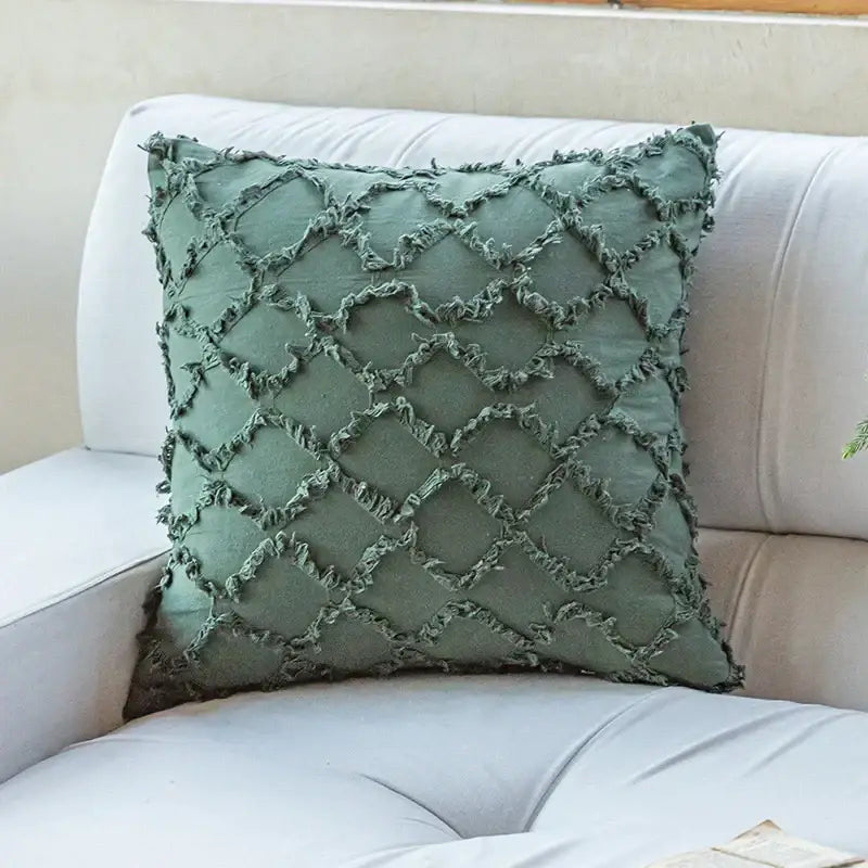 A sage green cotton diamond cushion cover with textured frayed diamond pattern from decorbites for living room decor