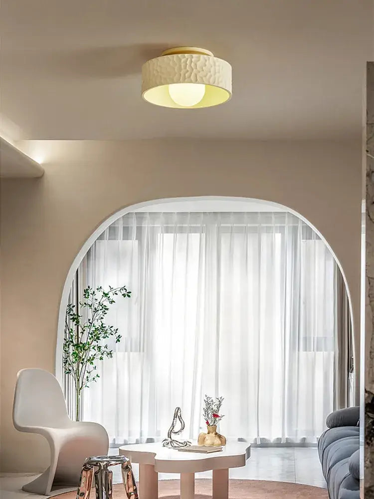 Textured cream ceiling light with gold trim featuring a warm diffused glow ideal for living room decorbites ceiling light
