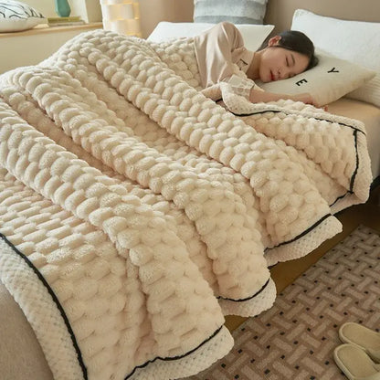 Cream-colored warm blanket with textured coral fleece knit pattern and black trim by decorbites for cozy bedroom use