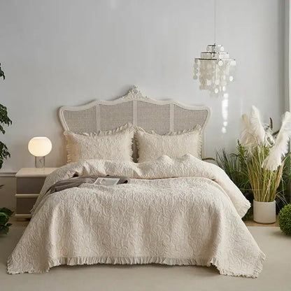 Cream-colored decorbites cotton quilted bedspread set with delicate floral pattern and fringed edges for bedroom decor