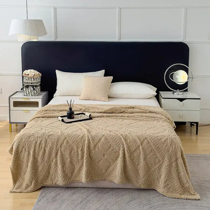 Beige textured knit throw blanket with diamond-patterned design used as a sofa cover blanket for living room
