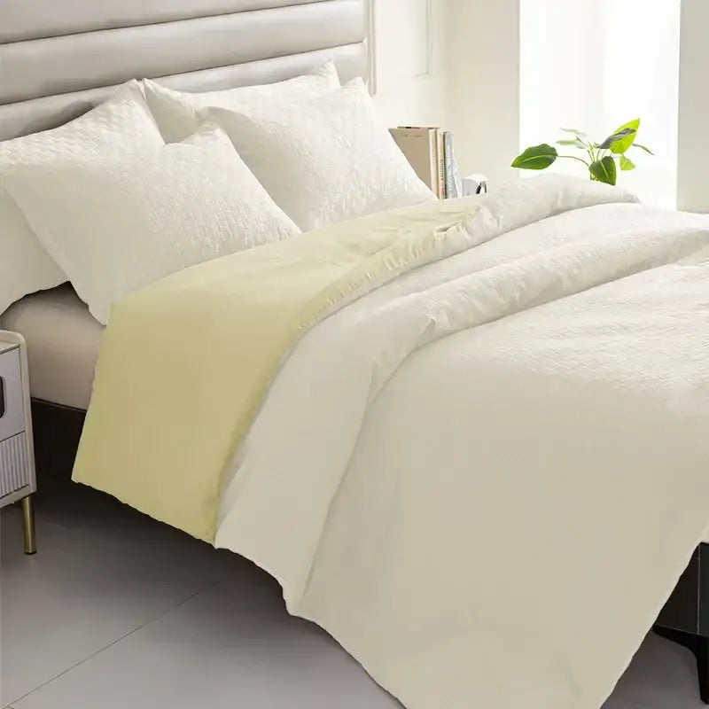 Cream-colored textured duvet cover with pale yellow border from a pillowcase quilt set by decorbites comforter