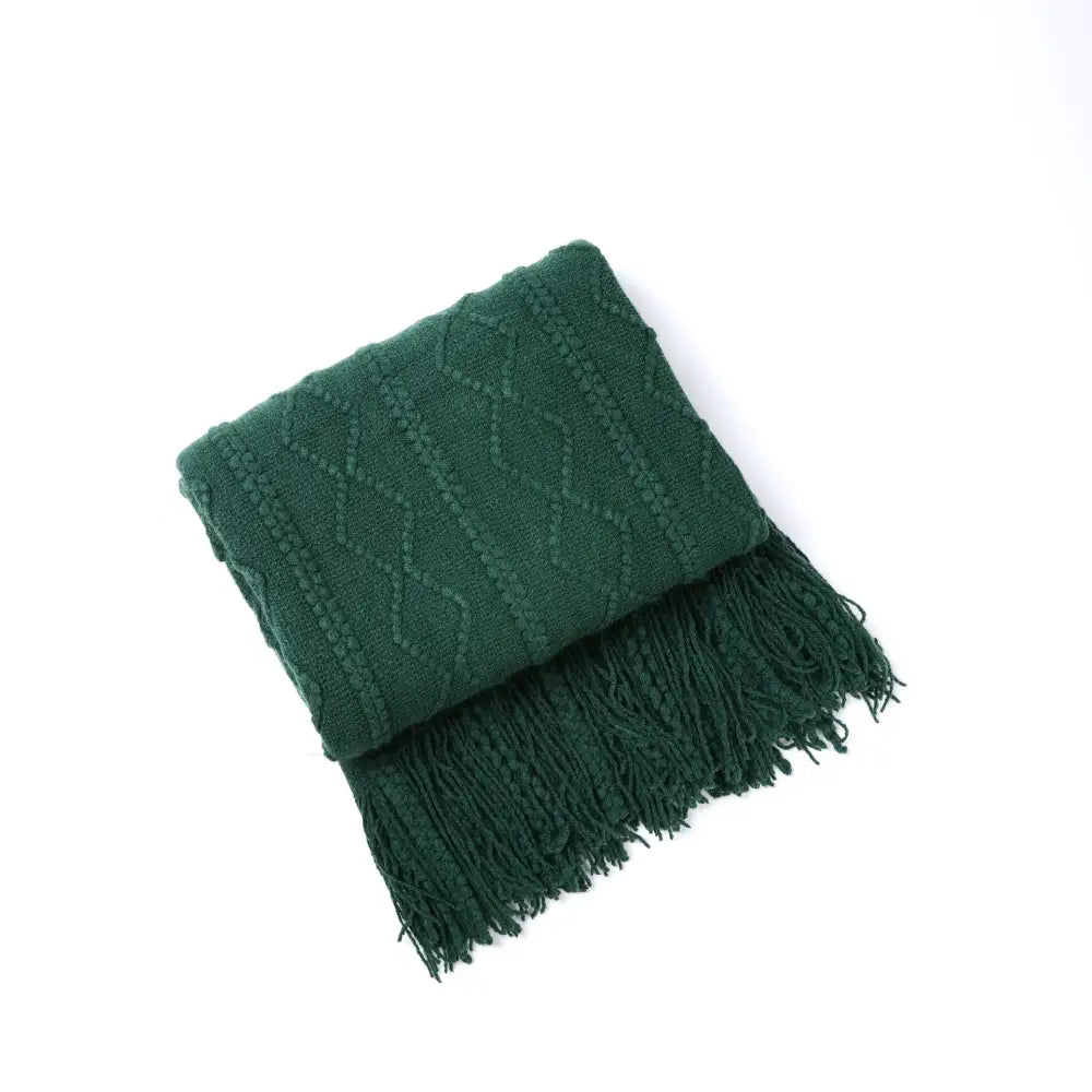Deep green knit throw blanket with textured diamond pattern and fringed edges for decorbites cozy knit living room decor
