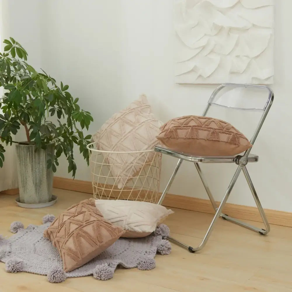 Beige textured cushion cover with geometric diamond embroidery living room design on a chrome folding chair