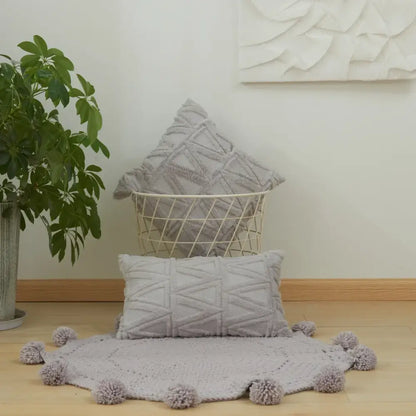 Gray textured throw pillow with geometric diamond embroidery living room cushion cover and pom-pom trim