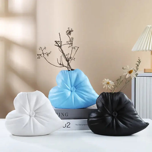 Three heart-shaped fluffy heart vases in white blue and black with textured pleated design for living room decor