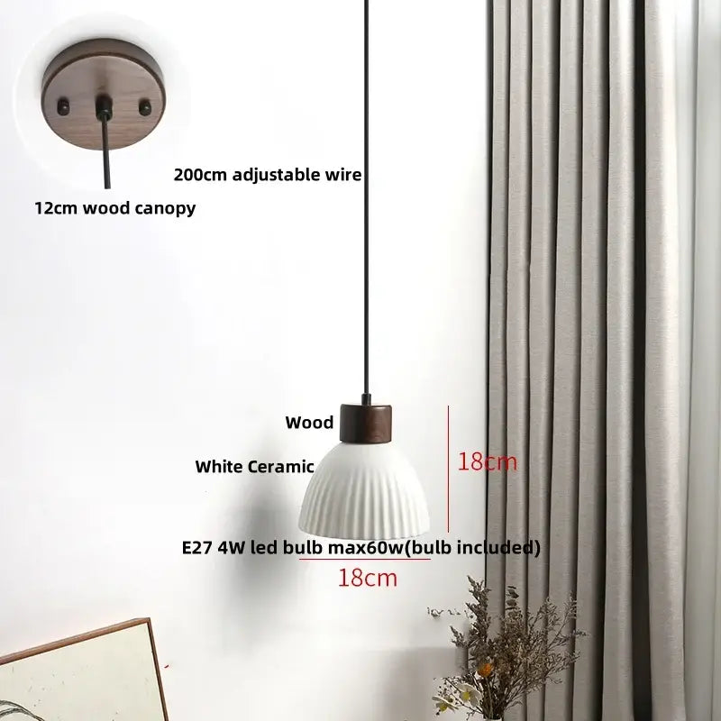 Minimalist pendant light with white ceramic textured shade and black wire, suspended from 12cm wood canopy for decorbites clear glass led lighting