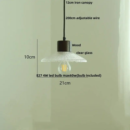 A rustic pendant light with dark wood canopy and clear glass led bulb ideal for kitchen decorbites clear glass design