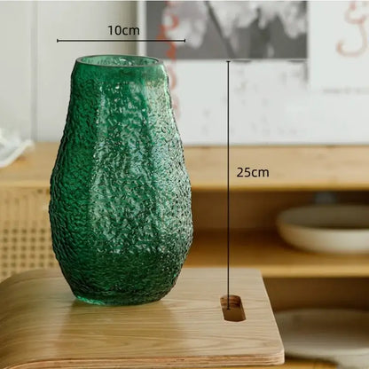 A textured frosted emerald green transparent glass vase with organic shape and ridges for living room decorbites decor