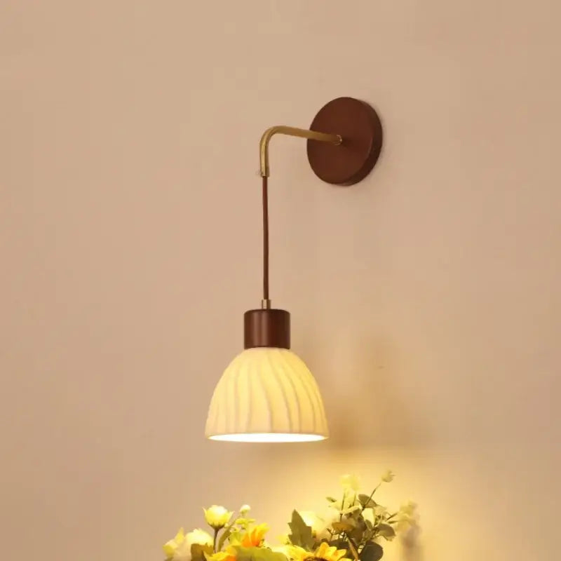 Warm-toned decorbites adjustable led wall light with ribbed off-white glass shade and dark wood-finished metal arm for bedroom decor
