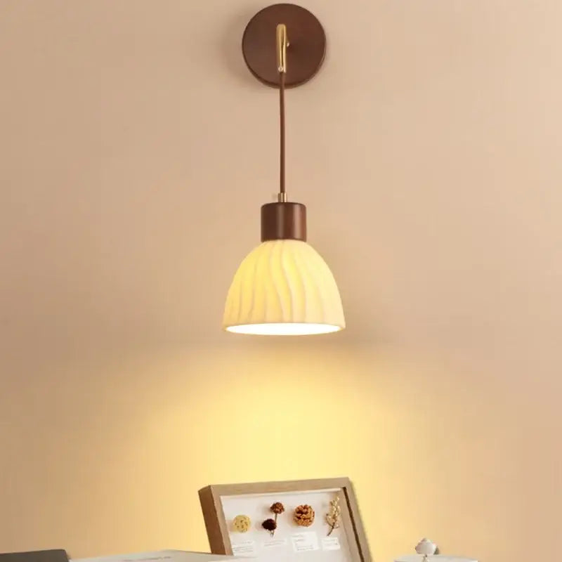 Warm-toned ribbed glass and dark wood decorbites adjustable led wall light for bedroom sconce decor