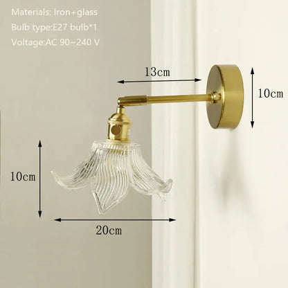 Delicate gold-toned wall sconce with clear ribbed glass shade and brass mirror for bedroom decorbites brass mirror