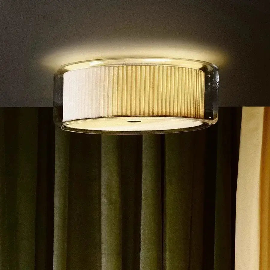 Textured gold ceiling lamp with ribbed off-white pleated glass shade encased in clear acrylic for bedroom use