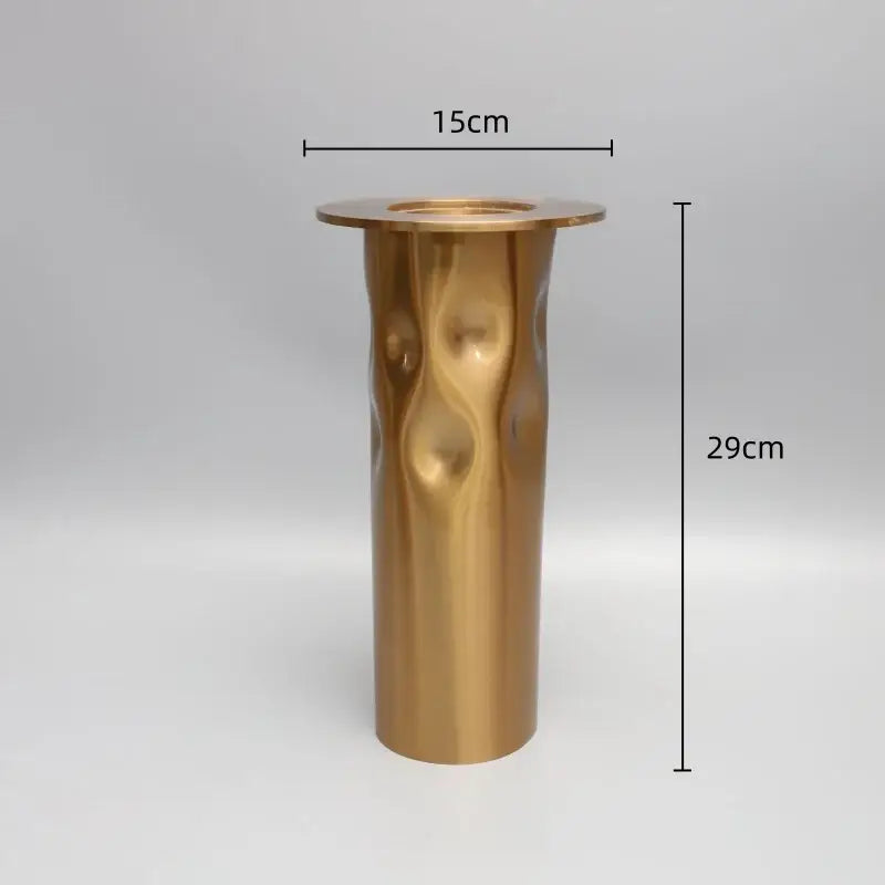 A tall 29cm decorbites golden metal candlestick holder with hammered texture and flared rim for dining room decor
