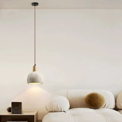 Minimalist pendant lamp with textured off-white ceramic shade and natural wood accent for dining room decorbites cement chandelier