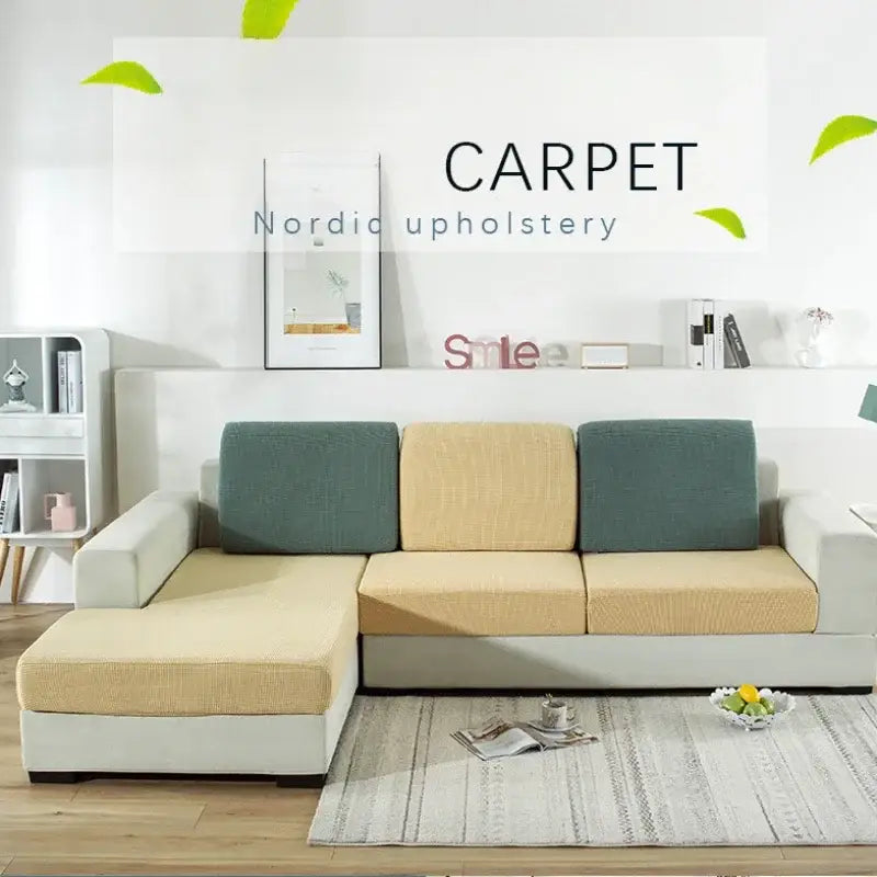 Beige and teal upholstered l-shaped sectional sofa with textured fabric finish featuring a green and beige elastic sofa cover