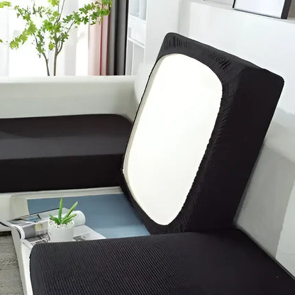 Black textured fabric sofa cover with white panel on backrest for living room furniture protection