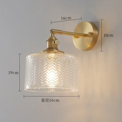 Gold-toned wall sconce with clear glass nordic shade featuring chevron pattern and green ceramic brass led light for bedroom