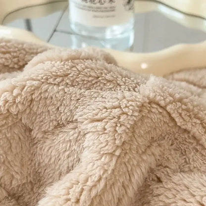 Beige plush fleece lamb wool blanket with soft textured surface from decorbites cozy lamb collection for bedroom use