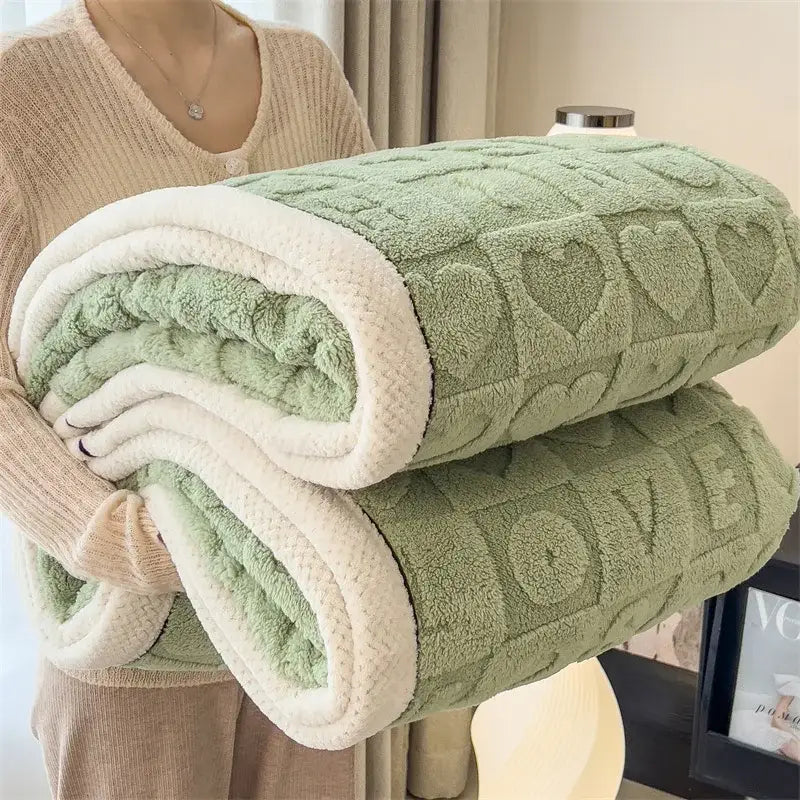 A cozy lamb wool blanket in green and cream fleece with a textured heart pattern for decorbites cozy lamb decor
