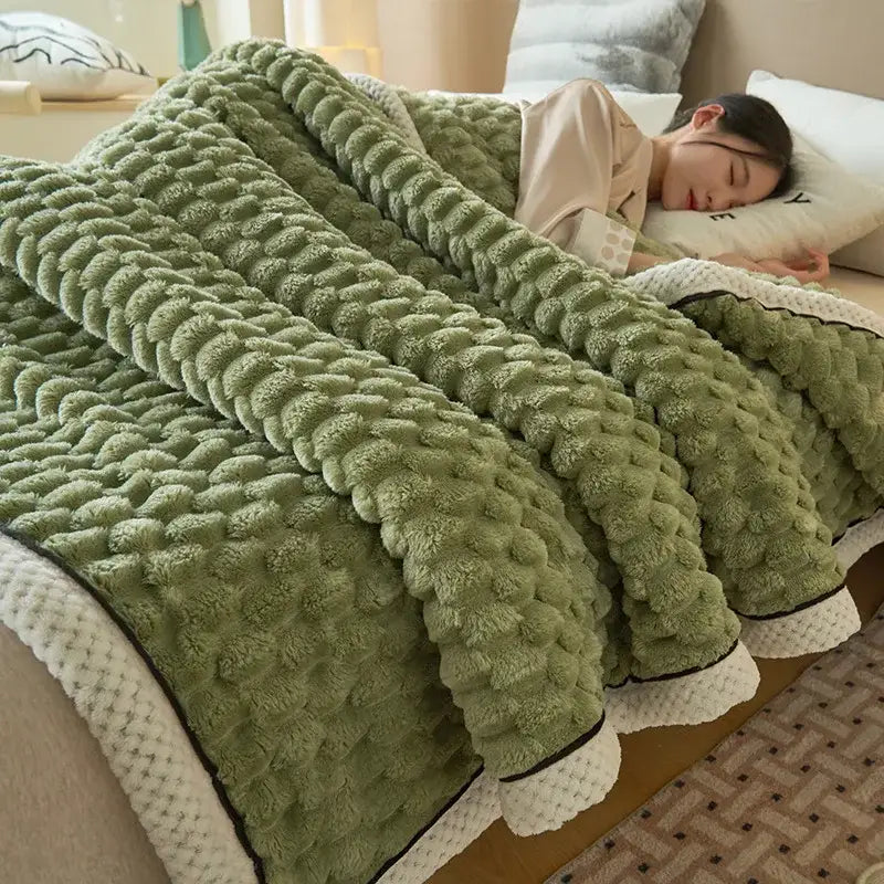 An olive-green textured blanket with soft fuzzy surface and white trim from decorbites cozy taffeta velvet collection