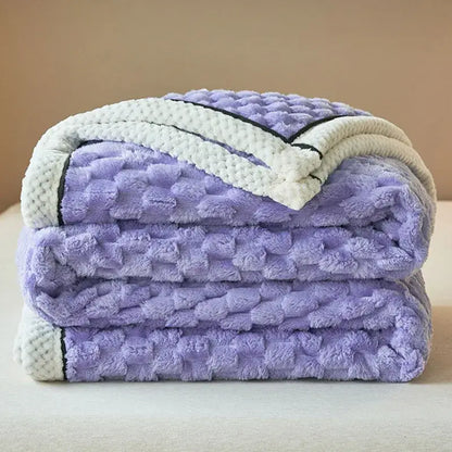 Stacked lavender plush throw blanket with textured quilted surface and cream border cozy taffeta velvet blanket decorbites
