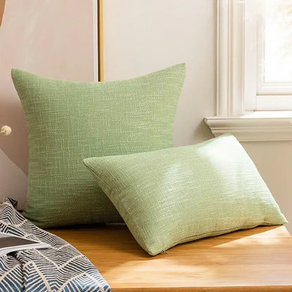 Two light green textured linen cotton throw pillows with subtle woven pattern for living room decorbites linen cotton