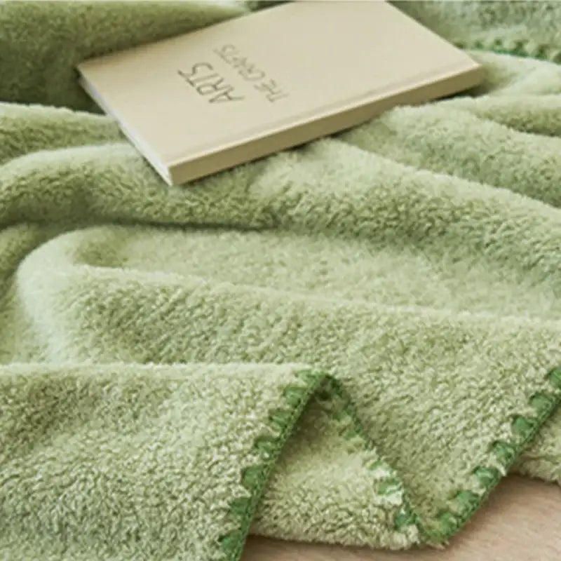 A soft light green plush textured towel with matching stitched edge from decorbites cloud comforter collection