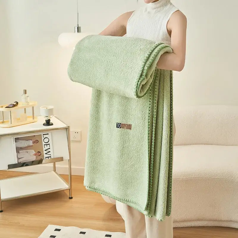 A soft mint green terry cloth bath towel with textured loops and neat edges for decorbites cloud comforter use