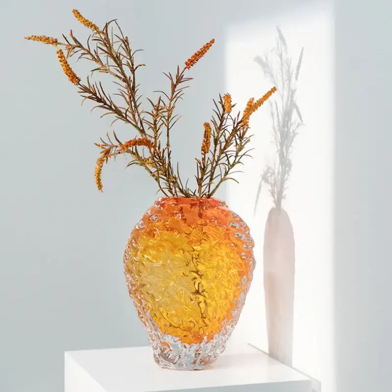A vibrant textured glass colored vase in orange and yellow hues for elegant living room decor