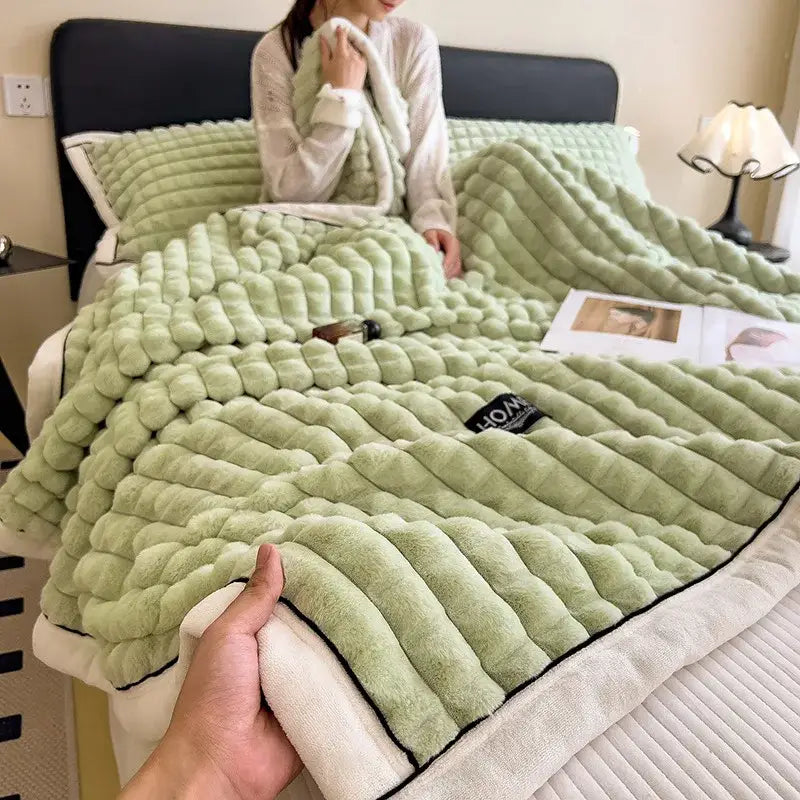 A plush light green textured cozy flannel velvet blanket with white lining featured in decorbites cozy flannel collection