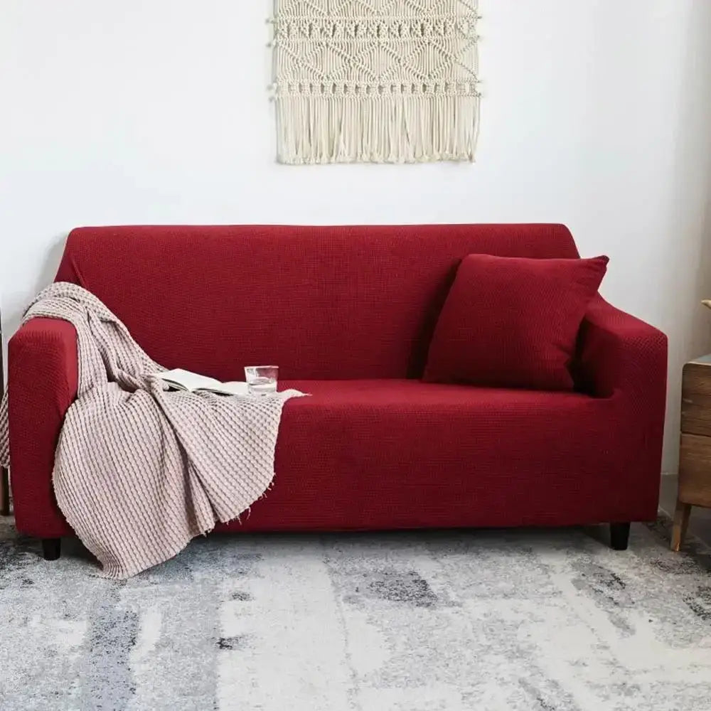 Red textured cozy fleece sofa slipcover with matching pillow and beige striped throw blanket for living room decorbites cozy fleece