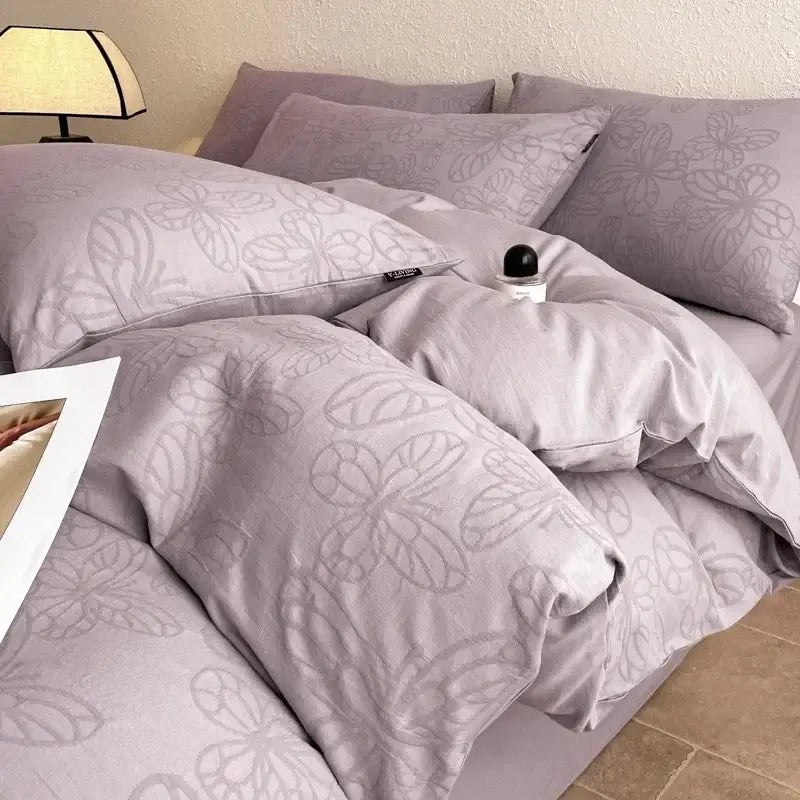 Lavender-colored bedding set with subtle butterfly embroidery made from decorbites cotton three-layer fabric for soft comfort
