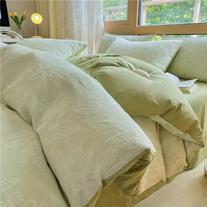 A soft sage green quilted duvet set with subtle leaf pattern in textured decorbites cotton three-layer bedding set