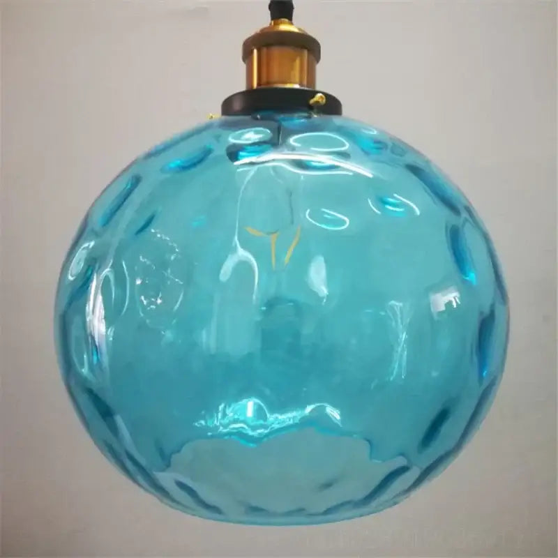 Textured turquoise blue glass ball pendant light with bubble surface and brass fixture perfect for decorbites blue glass pendant lights