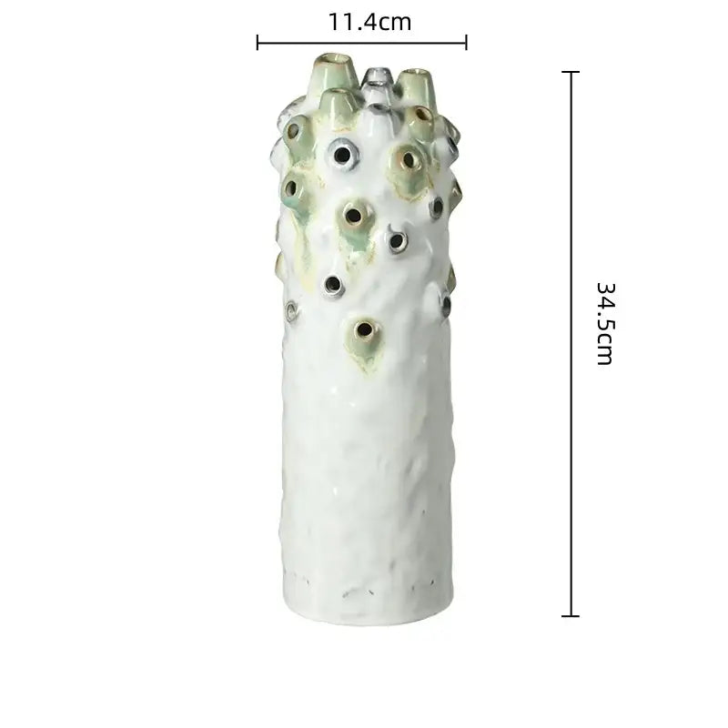 Textured white and green coral ball ceramic vase with sculpted surface featuring circular openings for living room decorbites coral ball